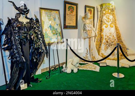 A leading lady Mardi Gras gown is displayed alongside the Mardi Gras gown and regalia of the 2022 Mardi Gras queen at Mobile Carnival Museum in Mobile. Stock Photo