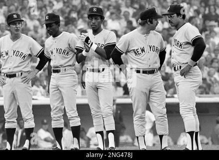 Reggie Jackson, manager Billy Martin and Graig Nettles of the New York  Yankees are all smiles on the way to the dugout after beating the Chicago  White Sox 7-6 in 11 innings