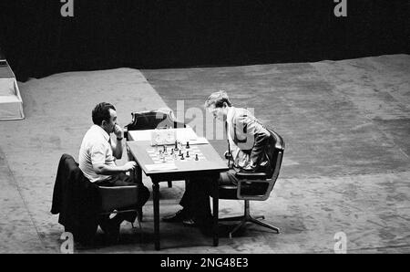 ** FILE ** Then fifteen-year-old chess star Bobby Fischer, left, and  Russian grand master Tigran Petrosian play a practice game at Moscow's  Central Chess Club, June 30, 1958. Fischer, the reclusive chess genius who  became a Cold War hero by dethroning