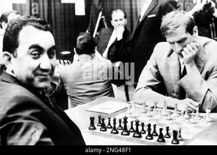 ** FILE ** Then fifteen-year-old chess star Bobby Fischer, left, and  Russian grand master Tigran Petrosian play a practice game at Moscow's  Central Chess Club, June 30, 1958. Fischer, the reclusive chess genius who  became a Cold War hero by dethroning