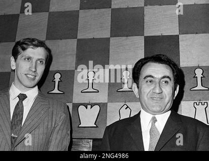 ** FILE ** Then fifteen-year-old chess star Bobby Fischer, left, and  Russian grand master Tigran Petrosian play a practice game at Moscow's  Central Chess Club, June 30, 1958. Fischer, the reclusive chess genius who  became a Cold War hero by dethroning