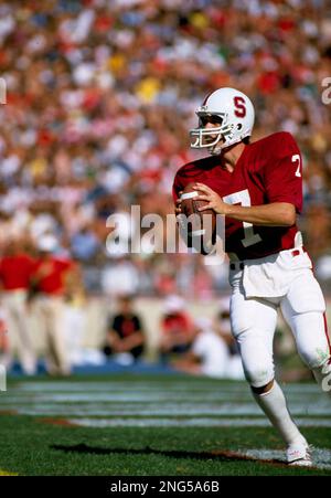 Stanford University quarterback John Elway, right, laughs with his father  Jack Elway during a press conference in afternoon on Tuesday, April 26,  1983 in San Jose, Calif., after announcing he'll play baseball