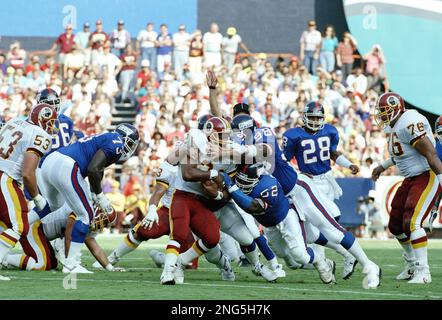 Washington Redskins running back Earnest Byner (21) confronts Philadelphia  Eagles line back Seth Joyner during the second half action at RFK Stadium  in Washington D.C., Oct. 1, 1991. Byner scored one touchdown