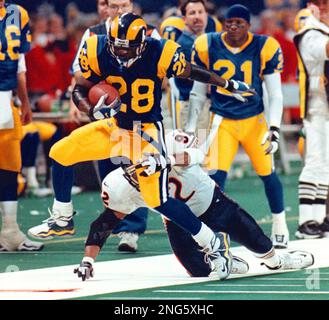 New York Giants' Keith Elias (25) flips over the goal line to score as  Chicago Bear Barry Minter (92) tackles during the fourth quarter in  Chicago, Ill., Aug. 27, 1994. The Bears