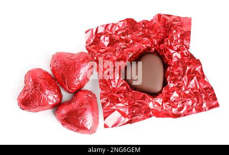 Heart shaped chocolate candies on white background, top view Stock Photo