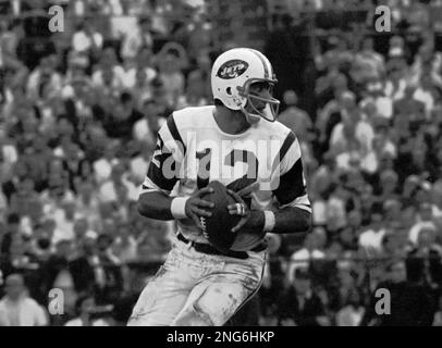 New York Jets quarterback Joe Namath, (12), gets the pass off down