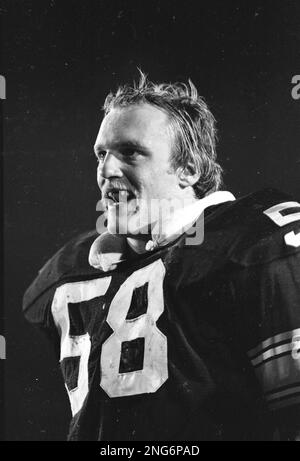 FILE - Los Angeles Rams running back Wendell Tyler (26) is thrown for  4-yard loss by Pittsburgh Steelers linebacker Jack Lambert as Steelers L.C.  Greenwood (68), Gary Dunn (67) and Mean Joe