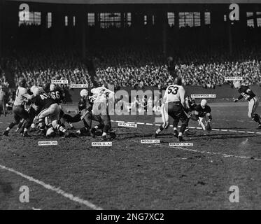 Lou Groza, the Cleveland Browns tackle with the Atomic Toe, is shown  approaching the ball as he exploded a towering field goal to aid in a 31 to  14 defeat of the