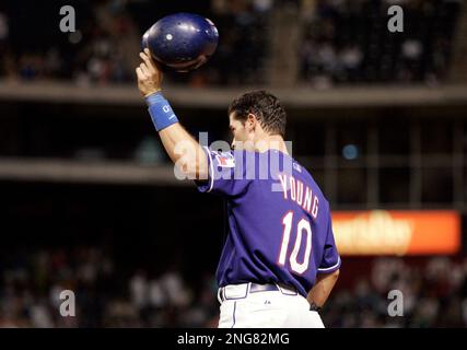 Texas Rangers' Michael Young, looks on after getting his 211th hit