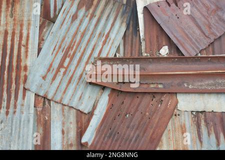 old rusty metal roofing sheets, pattern of unusable galvanized corrugated surface corrosion, full frame background texture, vintage or retro concept Stock Photo