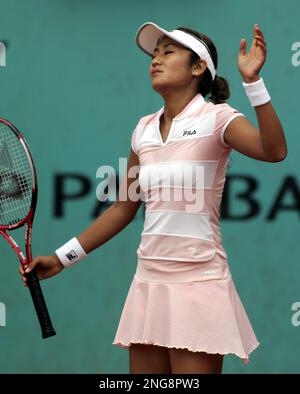 Japan's Akiko Morigami reacts after losing a second round match against U.S. player Shenay Perry during the French Open tennis tournament at the Roland Garros stadium in Paris, Thursday June 1, 2006. (AP Photo/Michel Euler)