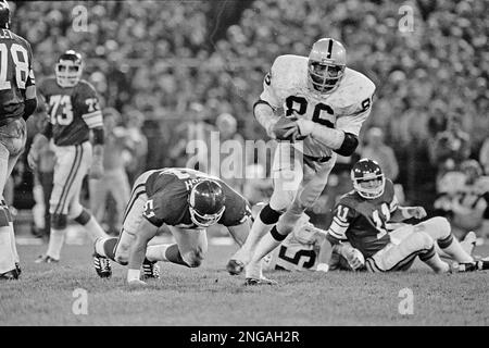 Oakland Raiders defensive end Cedrick Hardman (86) picks up a fumble by  Minnesota Vikings quarterback Wade Wilson (11) rear, and heads for the goal  line in the fourth quarter of Monday night's