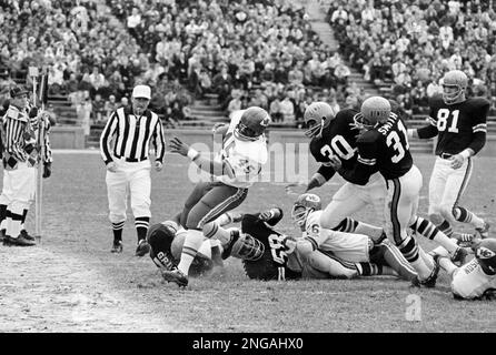 Kansas City's Bobby Holmes left four Cincinnati Bengals in his wake as he  leaned around his right end for a nine-yard gain in AFL game in Cincinnati,  Ohio, Nov. 10, 1968. Bengals are; Jim Griffin (76) and Al Beauchamp (58) on  the ground and Jess Philli