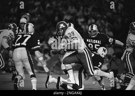 Miami Dolphins fullback Larry Csonka (39) grinds out the yardage in their  game against the Buffalo Bills at The Orange Bowl in Miami, Fla., Oct. 22,  1972. Making the stop in the