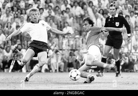Italy's Marco Tardelli, right, hits the ball past West German defender Bernd Foerster, to score his side's second goal during the World Cup soccer final, at Madrid's Santiago Bernabeu stadium, Sunday, July 11, 1982. Italy won the match 3-1. (AP-Photo/stf)