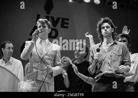 LIVE AID Wembley Stadium 13 July 1985. Clearing up.Photo Hanne Jordan ...