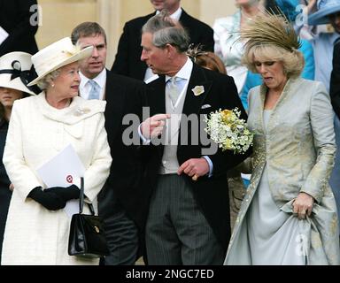 Britain's Prince Charles, centre, speaks with his mother Queen Elizabeth as he holds the arm of his bride Camilla Duchess of Cornwall as they leave St George's Chapel in Windsor, England following the church blessing of their civil wedding ceremony, Saturday, April 9, 2005. In the background between Queen Elizabeth and Prince Charles, stands Prince Andrew the Duke of York. (AP Photo/ Alastair Grant, Pool)