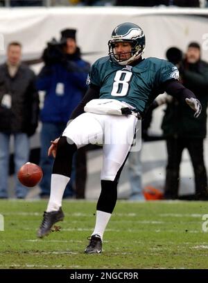 Jacksonville Jaguars' Brian Iwuh (59) and Jorge Cordova (58) pummel  Philadelphia Eagles punter Dirk Johnson after he punted the ball at Lincoln  Financial Field in Philadelphia, Pennsylvania, Sunday, October 29, 2006. The