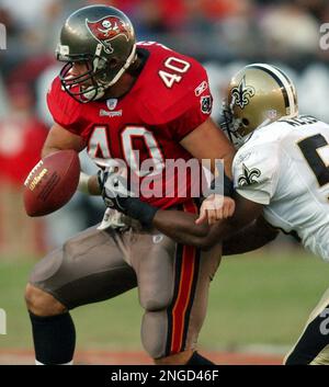 Indianapolis Colts running back Jim Finn (36) is stopped by New Orleans  Saints defenders Michael Hawthorne (36), James Allen (50) and Jermaine  Miles (96) during the first half of a preseason game