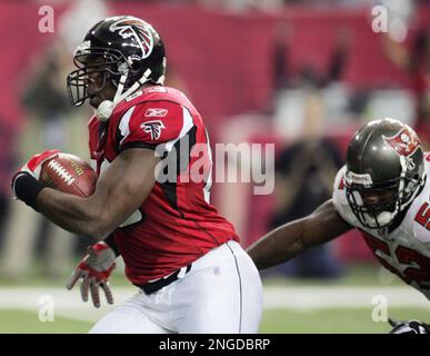 Tampa Bay Buccaneers running back Ian Smart (36) is hit by Tennessee Titans  cornerback Reynaldo Hill (21) as linebacker Cody Spencer (56) sails over  the play in the third quarter of their