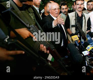 Palestinian Prime Minister Salam Fayyad is surrounded by bodyguards as he  gets out of his car during a visit to the West Bank town of Nablus,  Saturday, Dec. 29, 2007.(AP Photo/Nasser Ishtayeh