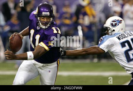 Tennessee Titans cornerback Andre Woolfolk is helped up by team physician  Dr. Burton Elrod, left, while playing the New Orleans Saints in a pre-season  football game in Nashville, Tenn. on Saturday, Aug.