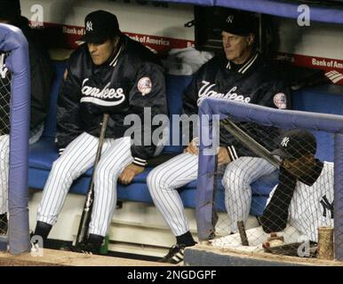 New York Yankees skipper Joe Torre (6) hugs third baseman Alex Rodriguez  after they defeated the Boston Red Sox, 8-4, assuring them of another AL  East Championship at Fenway Park in Boston