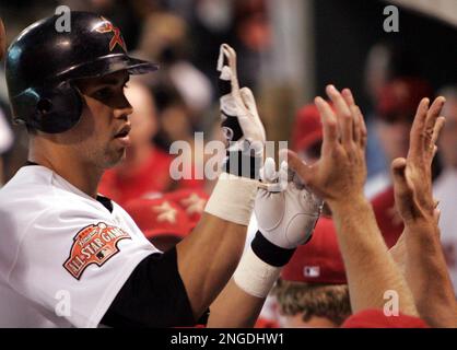 Houston Astros Carlos Beltran, left, is congratulated by teammate