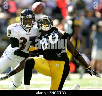 Baltimore Ravens cornerback Deion Sanders lines up against the