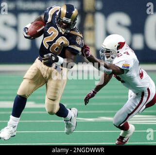 St. Louis Rams Marshall Faulk watches the action from the