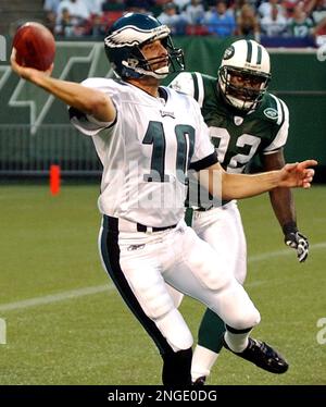 Philadelphia Eagles quarterback Koy Detmer, left, runs a passing drill with  fellow quarterback, A.J. Feeley, right, during the team's mini-camp  Wednesday, May, 28, 2003, in Philadelphia. (AP Photo/Brad C Bower Stock  Photo 