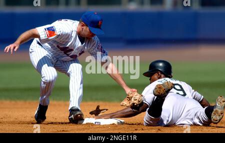 Florida Marlins' Juan Pierre steals second base under Philadelphia Phillies  infielder Jimmy Rollins during the first inning Wednesday, Sept. 17, 2003,  in Philadelphia.(AP Photo/Miles Kennedy Stock Photo - Alamy