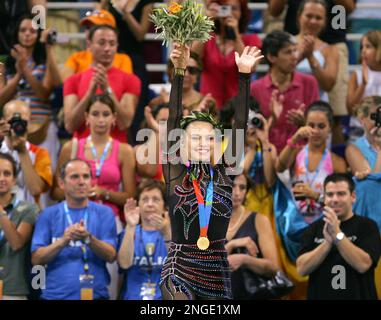Alina Kabaeva of Russia waves after she received her gold medal during ...