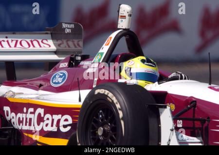 Bruno Junqueira, of Belo Horizonte, Brazil, guides his Ford-Cosworth Lola  for Neman/Haas Racing through the nine turn of the course of the Grand Prix  of Denver with other racers behind him on