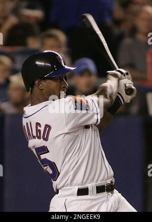 New York Mets' Mike Piazza is congratulated by Richard Hidalgo