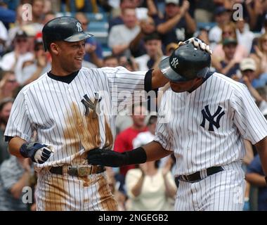 The Florida Marlins celebrate their 3-2 win over the New York Yankees in  Game 1 of the World Series at Yankee Stadium on October 18, 2003.  (UPI/Roger L. Wollenberg Stock Photo - Alamy