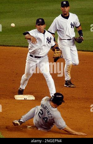 Tampa Bay Devil Rays' Tino Martinez, right, argues with umpire