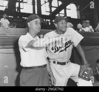 Pee Wee Reese poses with Pete Reiser at Ebbets Field in Brooklyn in 1949.