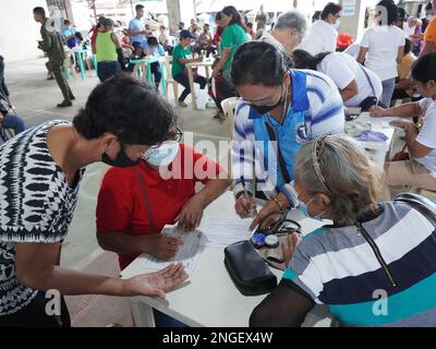 Palapag, Philippines. 18th February, 2023. Soldiers assisting patients during the 26th Mindanao Humanitarian Volunteers for Peace (MHVP) medical mission in Palapag town in Northern Samar. The free eye check-up, cataract operation and medical mission is aimed of bringing basic government services in conflict-torn areas in the Philippines infested by the communist-terror-group NPA.  (Credit Image: © Sherbien Dacalanio/Alamy Live News) Stock Photo