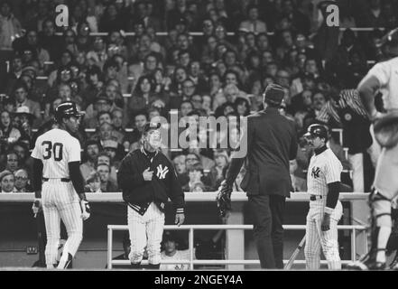 Reggie Jackson, manager Billy Martin and Graig Nettles of the New York  Yankees are all smiles on the way to the dugout after beating the Chicago  White Sox 7-6 in 11 innings