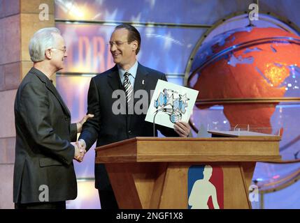 Russ Granik, deputy commissioner of the NBA, left, and Washington Wizards  owner Abe Pollin, right, announce during a news conference at the MCI  Center in Washington, Saturday, Dec. 4, 1999, that the