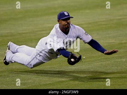 Mar 30, 2002; Oakland, CA, USA; San Diego Padres' Pete Incaviglia, #24,  slams into the wall after catching a fly ball hit by Oakland A's Terrence  Long, #12, in the fourth inning