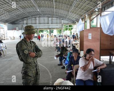 Palapag, Philippines. 18th February, 2023. Soldiers assisting patients during the 26th Mindanao Humanitarian Volunteers for Peace (MHVP) medical mission in Palapag town in Northern Samar. The free eye check-up, cataract operation and medical mission is aimed of bringing basic government services in conflict-torn areas in the Philippines infested by the communist-terror-group NPA.  (Credit Image: © Sherbien Dacalanio/Alamy Live News) Stock Photo