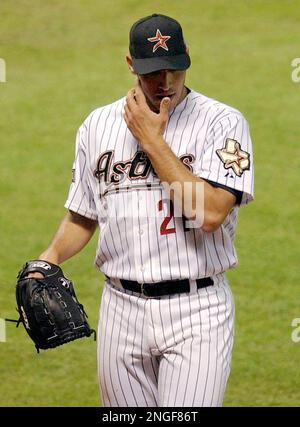 Houston Astros pitcher Andy Pettitte wipes his face with his jersey after  giving up a three-run homer to Los Angeles Dodgers' Nomar Garciaparra in  the third inning of a baseball game in