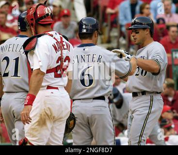 Los Angeles Dodgers' Paul Lo Duca, right, scores against Milwaukee Brewers'  Chad Moeller in the ninth inning to put his team on the score board Monday,  May 31, 2004, at Dodgers Stadium