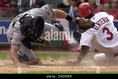 St. Louis Cardinals Edgar Renteria slides safely into home in front of  Pittsburgh Pirates catcher Humberto Coda in the first inning at Busch  Stadium in St. Louis on May 27, 2004. Renteria