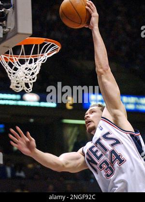 New Orleans Hornets center Aaron Williams (34) shoots the ball over New  Jersey Nets forward Jason Collins (35) in the second half of an NBA  basketball game Sunday, March. 12, 2006, in