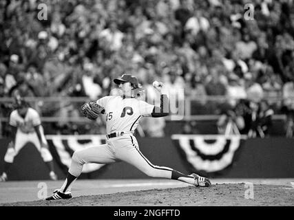 FILE - In this Oct. 21, 1980 file photo, Philadelphia Phillies third  baseman Mike Schmidt (20) races to celebrate with relief pitcher Tug McGraw,  arms upraised, and coach Billy DeMars (2) after