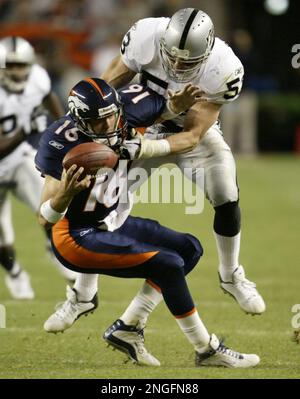 Atlanta Falcons quarterback Chris Chandler (12) is sacked by Denver Broncos  linebacker Bill Romanowski (53) during the first quarter of Super Bowl  XXXIII in Miami, Sunday, Jan 31, 1999. (AP Photo/Doug Mills