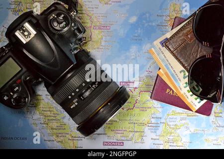 Travel concept - Camera, passport and map Stock Photo